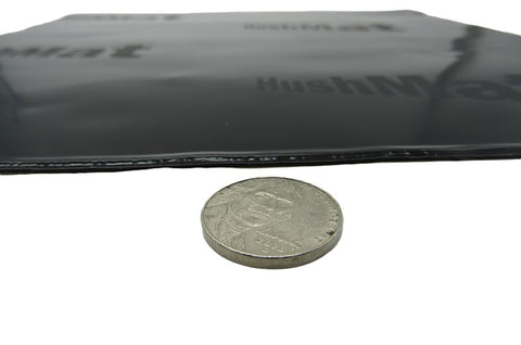 HushMat sheet thickness compared with a coin